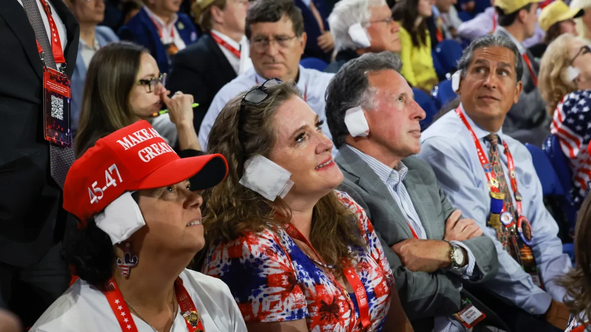 People wear "bandages" on their ears to support presidential candidate Donald Trump at the third day of the Republican National Convention in the Fiserv Forum on July 17 in Milwaukee, Wisconsin. Courtesy of Joe Raedle/Getty Images