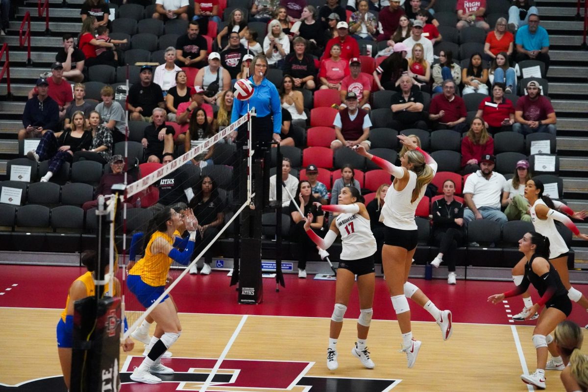 San Diego State setter Andrea Campos dumps the ball against San Jose State on Saturday, Nov. 9 at Aztec Court at Peterson Gym