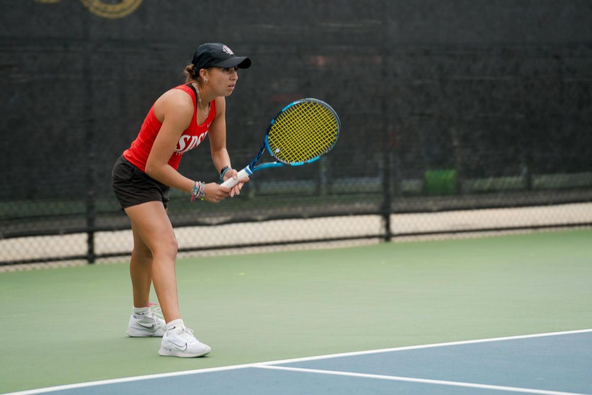 Senior Zoe Olmos getting ready to start off the first game of the ITA regional earlier this season at Aztec Tennis Center.

