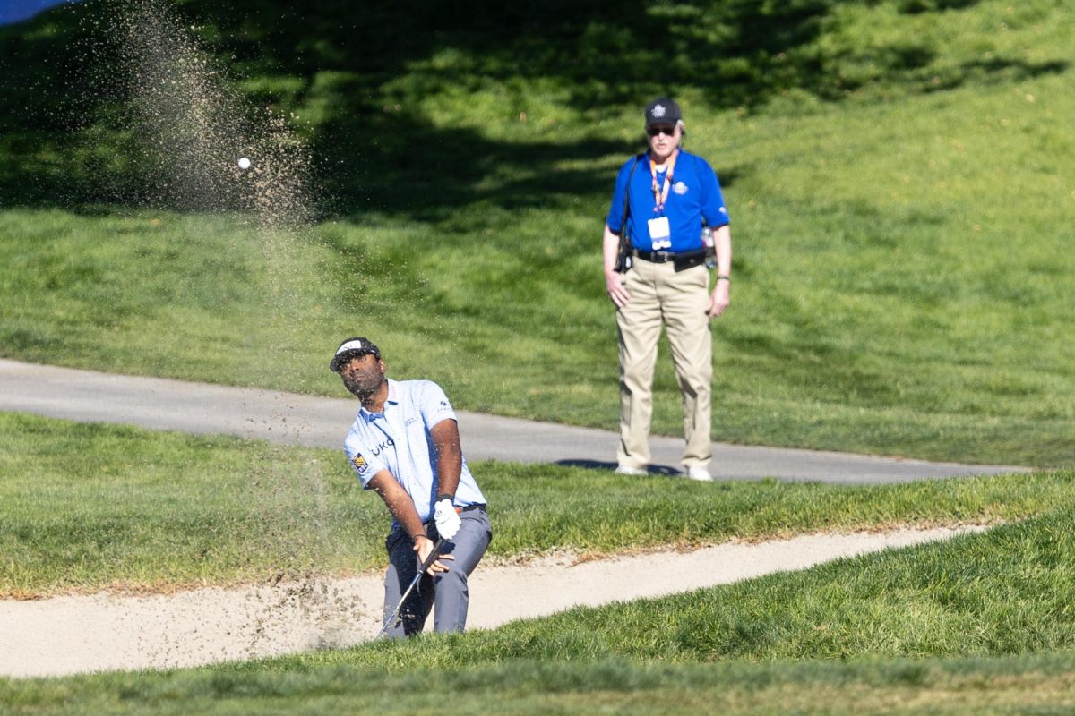 Sahith Theegala tries to get his golf ball out of the bunker on Thursday, Jan. 23, 2025, at the Farmer's Insurance Open in San Diego's Torrey Pines Golf Course.  