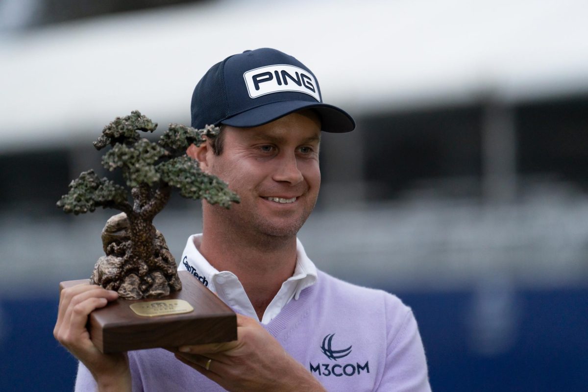 2025 Farmers Insurance Open winner Harris English accepts the trophy at Torrey Pines on Saturday, Jan. 25, 2025.   