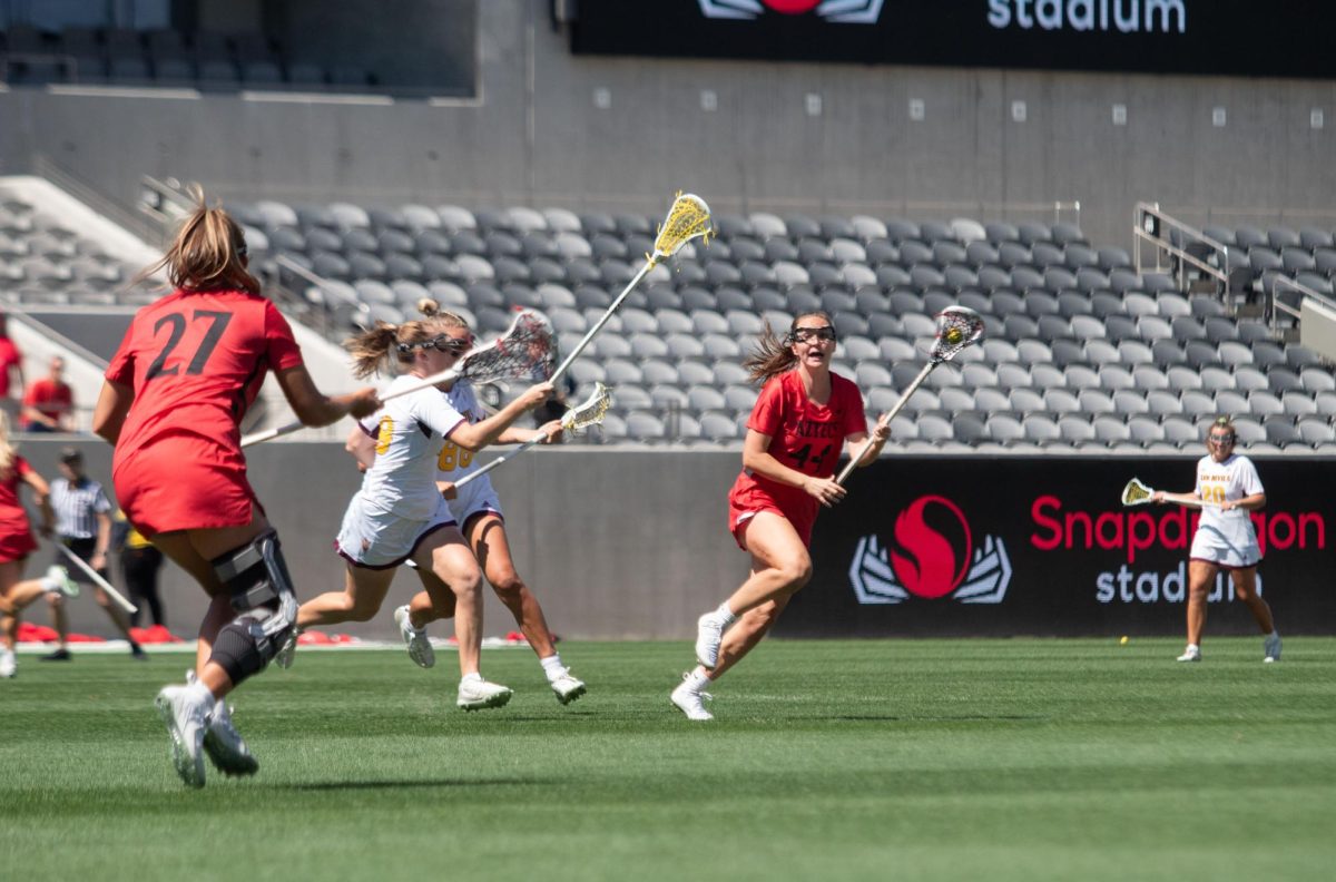 San Diego State defender Reilly Hunter looks to Brooklyne Waddell to pass at Snapdragon Stadium on March 17, 2024