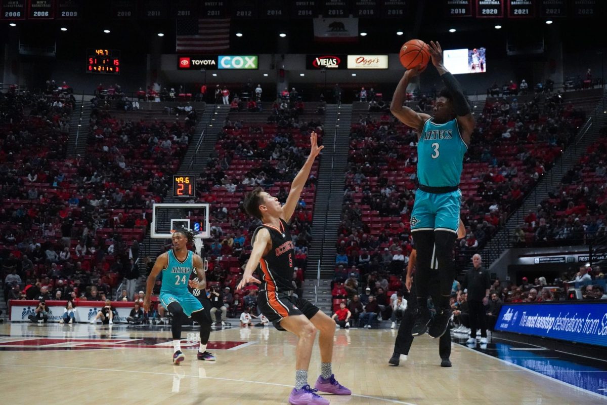 San Diego State senior guard Wayne McKinney III jumps to shoot on the court against Occidental earlier this season at Viejas Arena. 