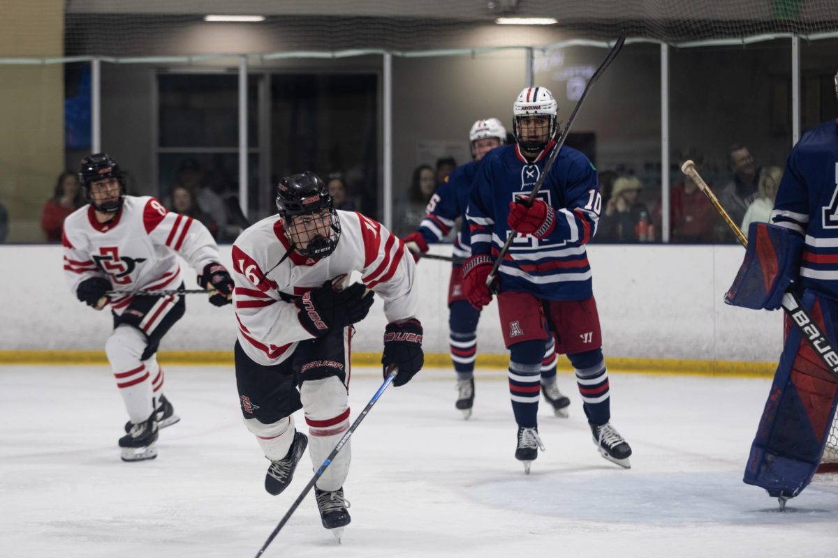 San Diego State University forward Kolby Hennessy surges past a University of Arizona defenseman during an intense game at Kroc Ice Arena in San Diego on Feb. 7.
