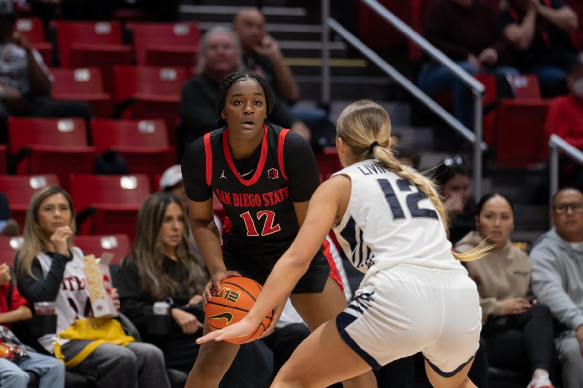 San Diego State freshman guard Kaelyn Hamilton tries to find an open teammate in a 78-63 Aztec win at Viejas Arena on Saturday, Feb. 15. 