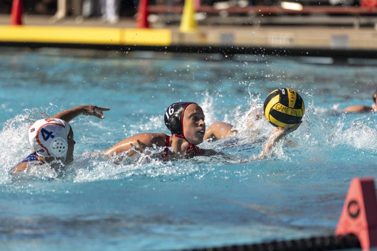 San Diego State center Mimi Stoupas controls possession of the ball during an earlier game in the season against Pomona-Pitzer at the Aztec Aquaplex on February 15th, 2025