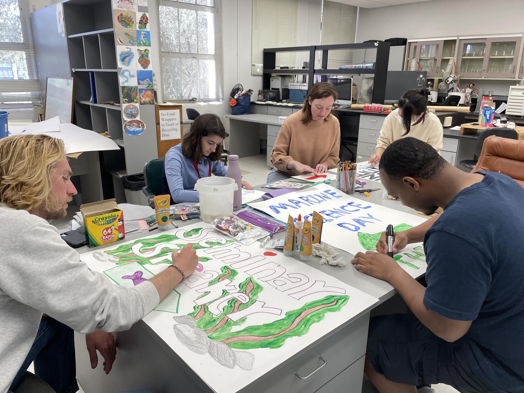 Marine Ecology and Biology Student Association members create signs at San Diego State University in preparation for Marine Science Day, Wednesday, April 23, 2025.