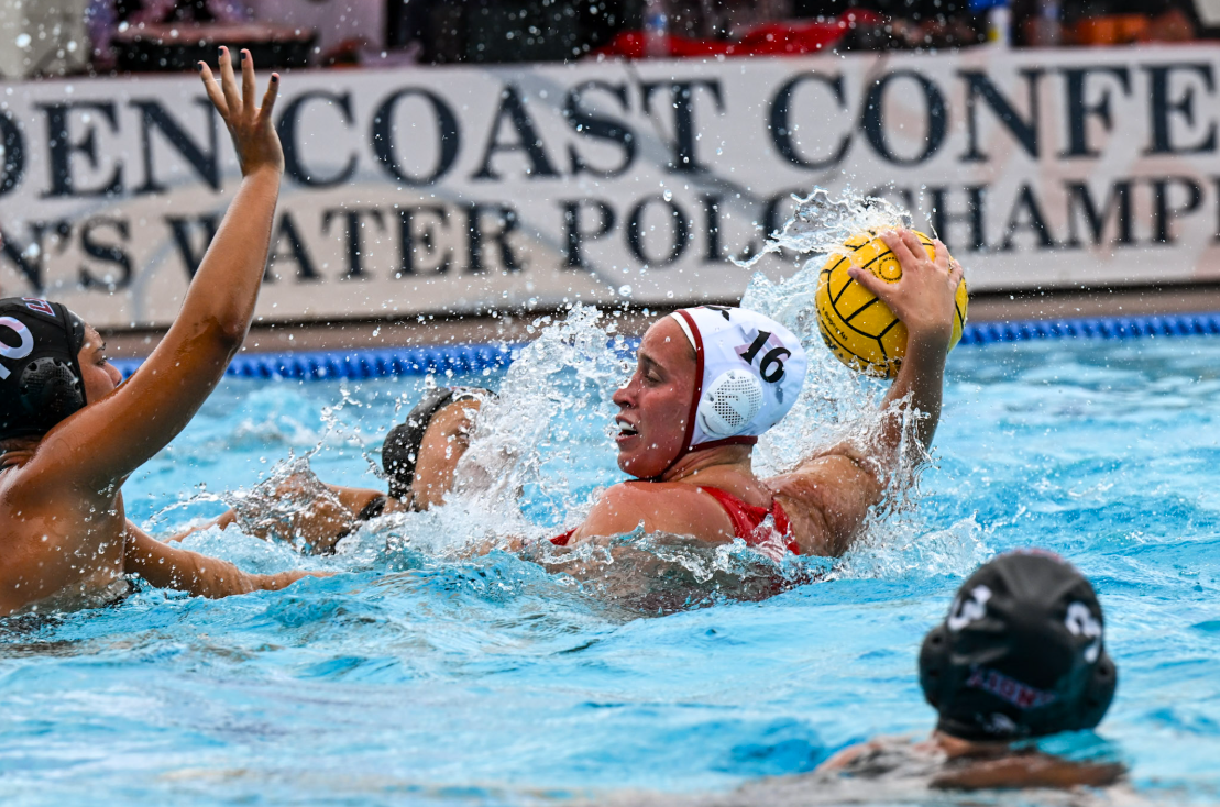 San Diego State center Mimi Stoupas looks to move the ball while being draped by defenders during the semifinals game against Loyola Marymount on Saturday, April 26. Image Courtesy of Golden Coast Conference.