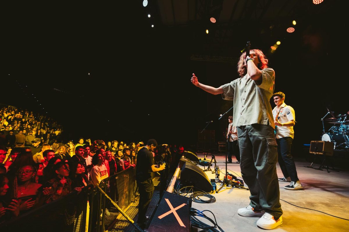 Evan Volk performing at the 2025 GreenFest concert with The White Collars. Photo by Sanchez Productions.