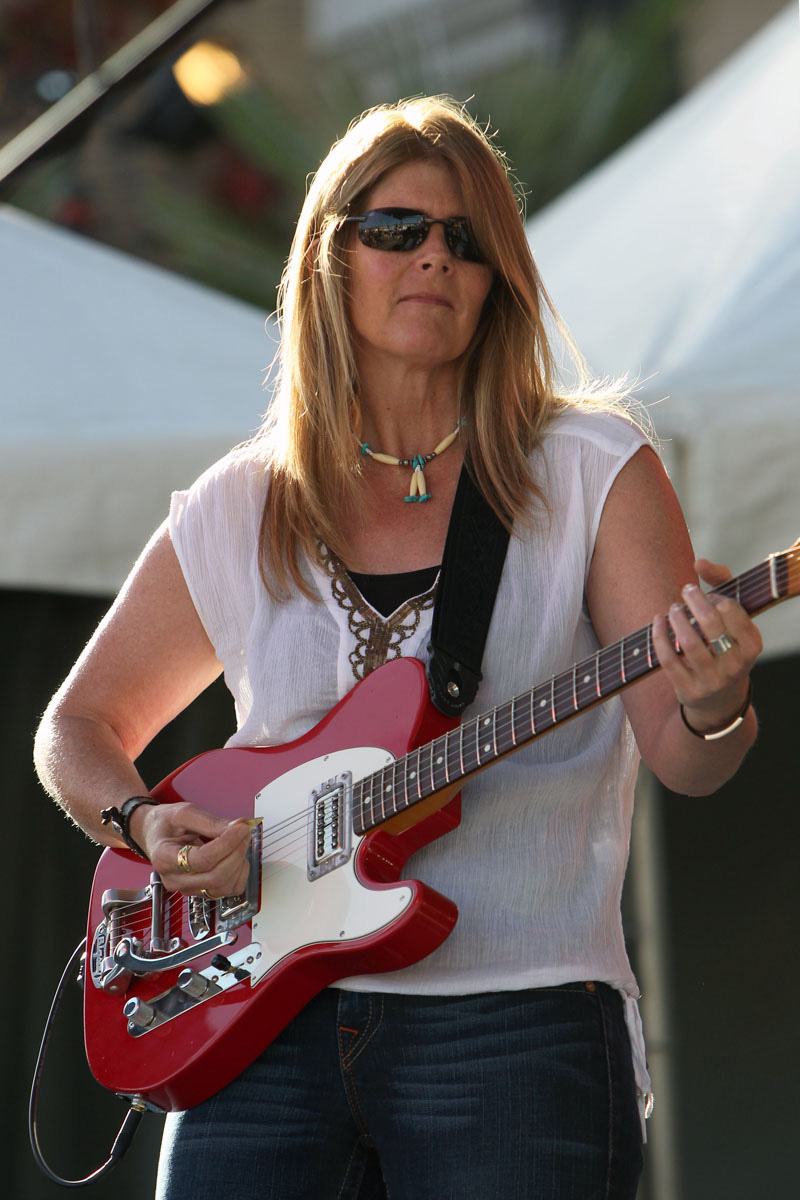 Holly Ransom plays the guitar onstage at a performance. Photo courtesy of Hugh Cox. 