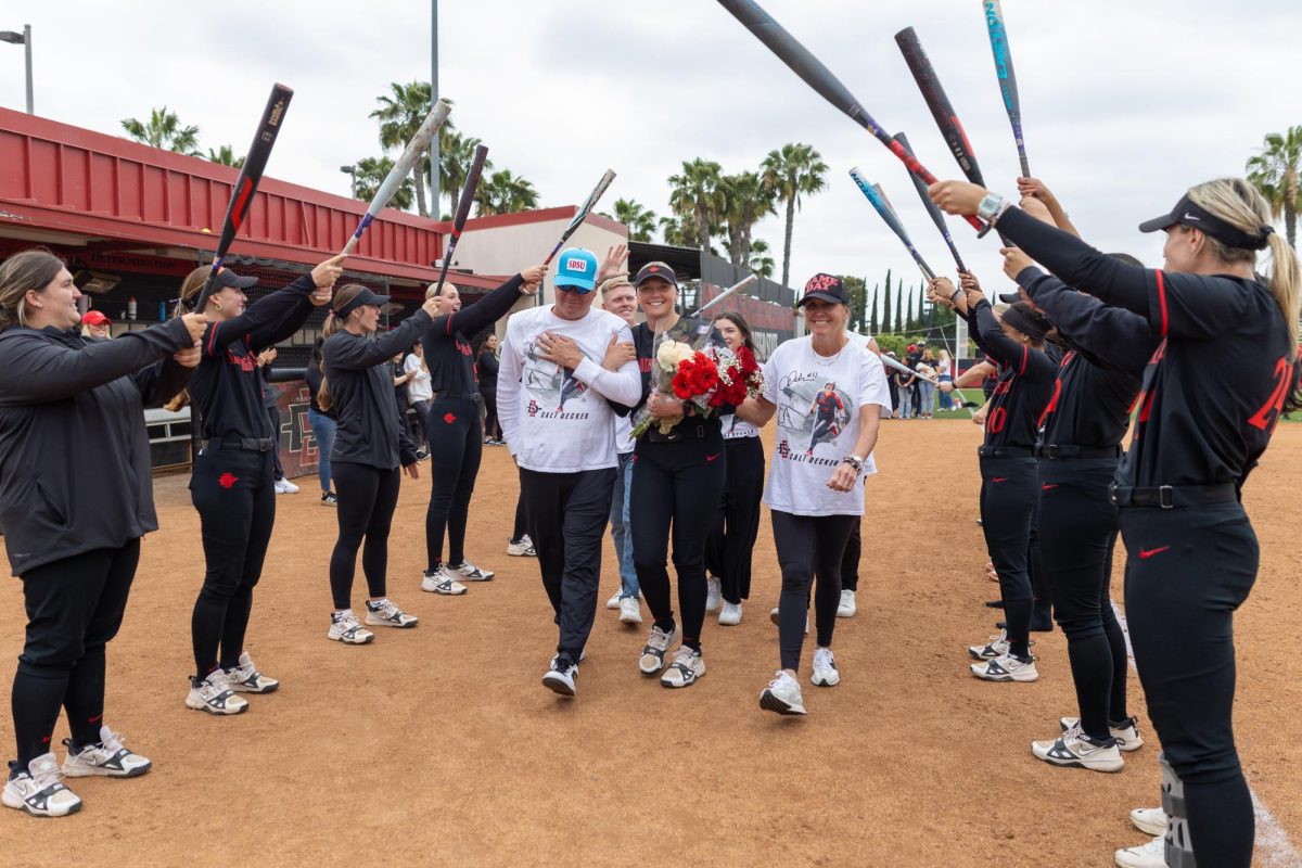 Family, friends and teammates gather to celebrate Cali Decker’s (11) achievements on Senior Day on Saturday, May 3, 2025, at SDSU Softball Stadium, Calif.