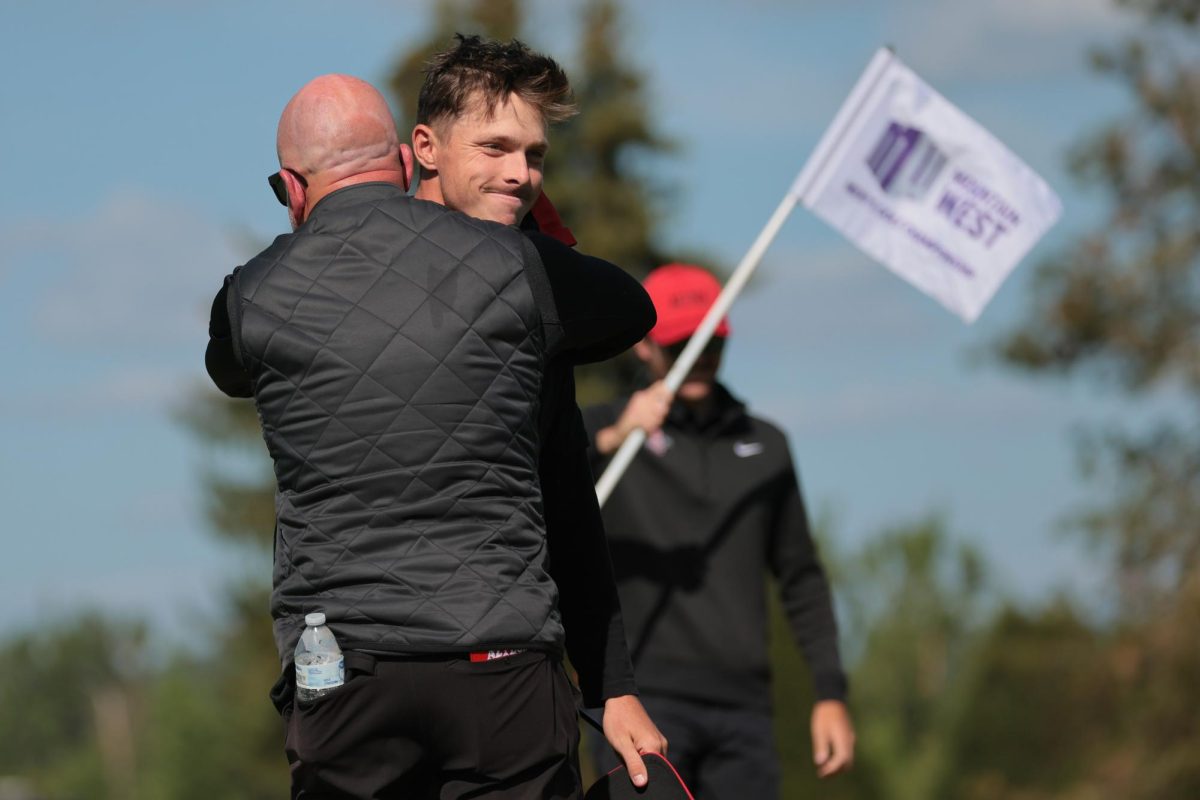 San Diego State's Justin Hastings and head coach Ryan Donovan embrace. Image courtesy of NCAA Photos. (Morgan Engel/SDSU Athletics)
