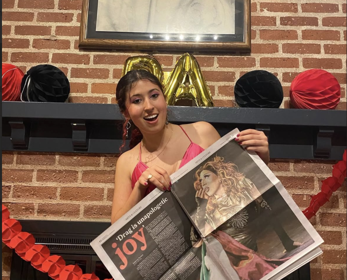 Katerina Portela poses with her cover story on the issue of The Daily Aztec at the publication's end of the year celebration on Friday, May 3, 2024. Photo by Naiima Paul.