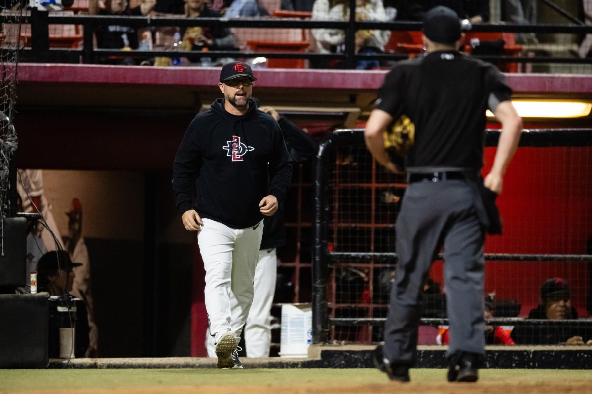 Former San Diego State baseball head coach Shaun Cole walks out of the bullpen to speak with an umpire during a game. Image courtesy of SDSU Athletics.
