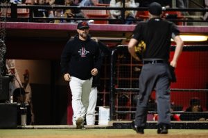 Former San Diego State baseball head coach Shaun Cole walks out of the bullpen to speak with an umpire during a game. Image courtesy of SDSU Athletics.
