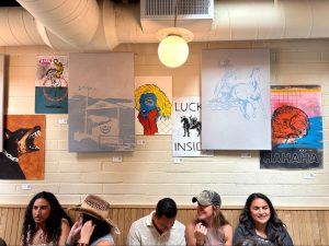 Residents and locals sip coffee and mingle at PorchLight’s “Brew and Groove” event, featuring the all-new “Phoenix” collection, which includes “Way West,” a western-inspired series by Kyler LeBlanc, on April 26 in Pacific Beach, San Diego.