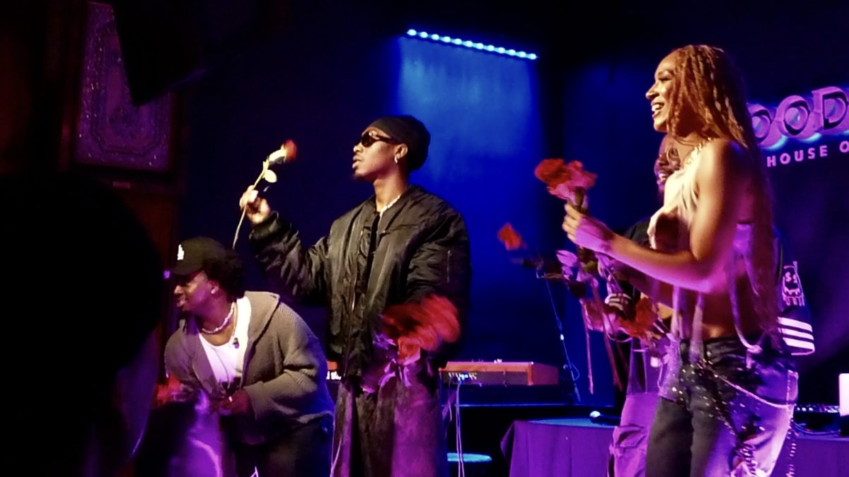 Chase Shakur, show opener Genia and keys player Daniel Barrett give out roses to close out Shakur’s show at the House of Blues on April 30. 