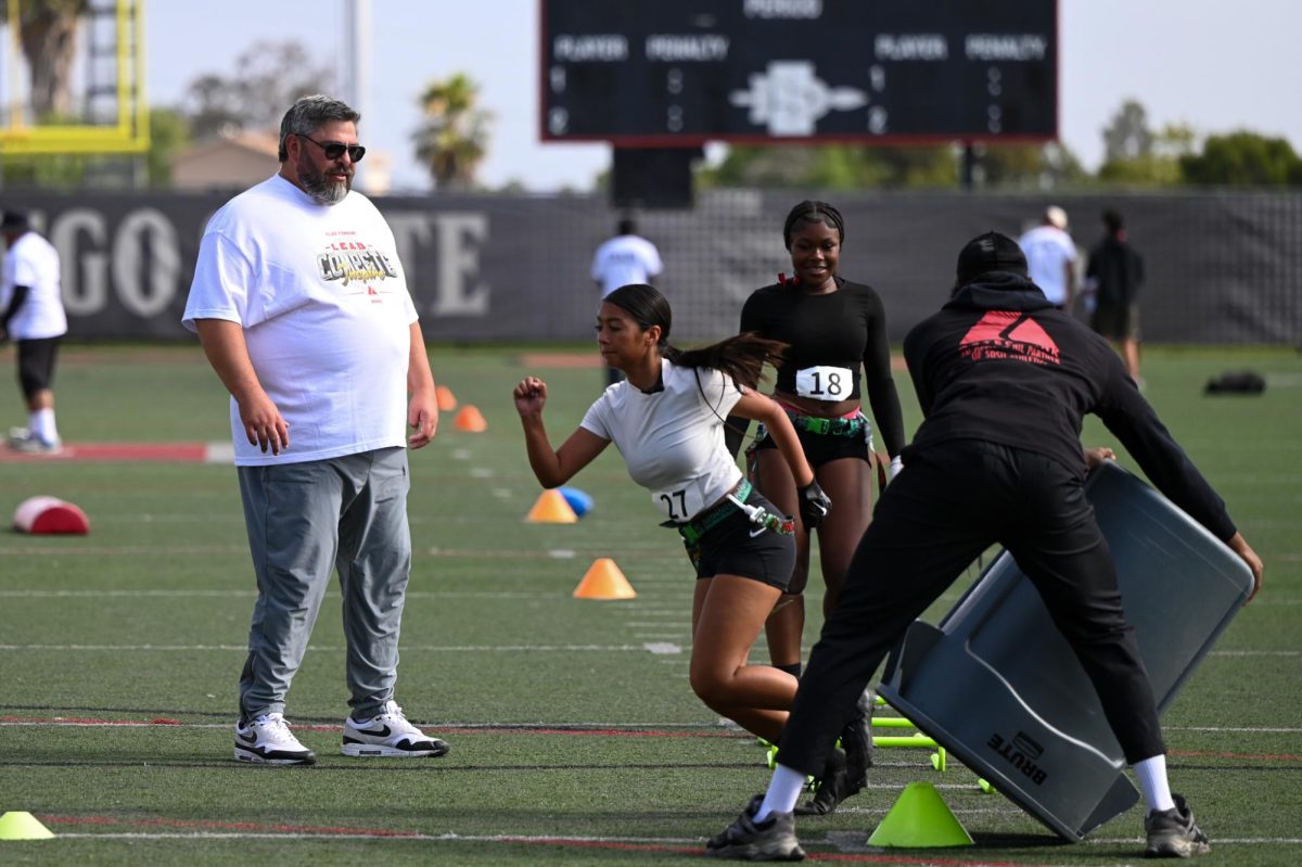 Southwestern runningback coach John Serrata supervises defense drills during the Aztec Link Female Flag Football Combine on Saturday June 21, 2025