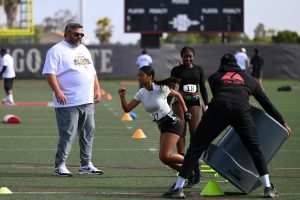 Southwestern runningback coach John Serrata supervises defense drills during the Aztec Link Female Flag Football Combine on Saturday June 21, 2025