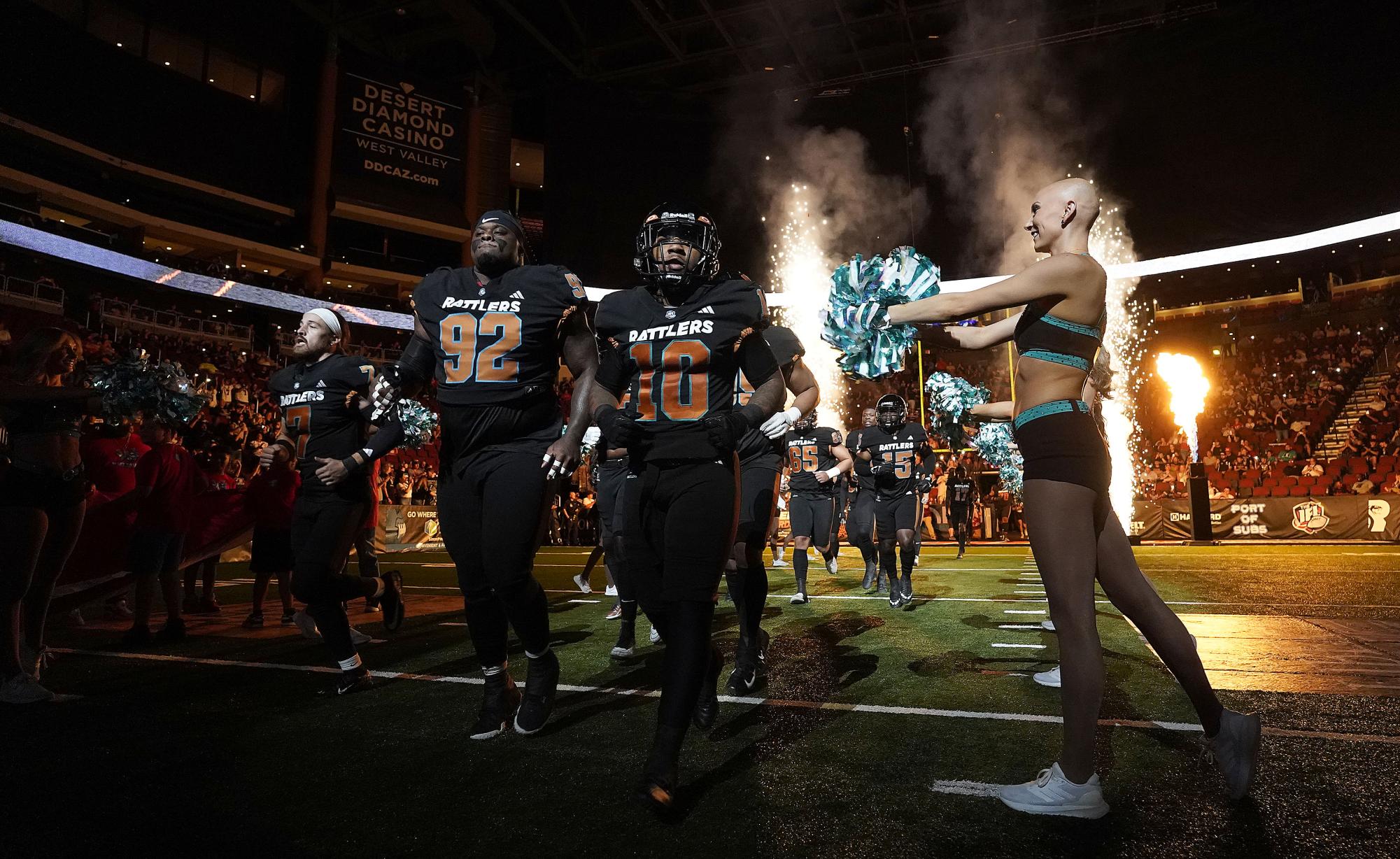 Arizona Rattlers running back Marquez Cooper runs onto the field with teammates out of the tunnel at Desert Diamond Arena. Photo Courtesy of the Arizona Rattlers. 