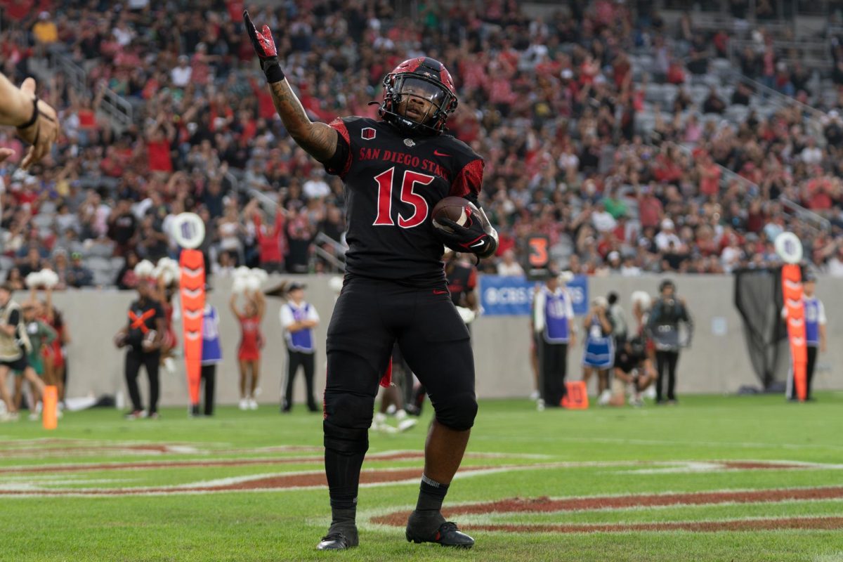 Former San Diego State running back Marquez Cooper celebrates in the endzone after a rushing touchdown against Hawaii at SnapDragon Stadium on Saturday October 5, 2024