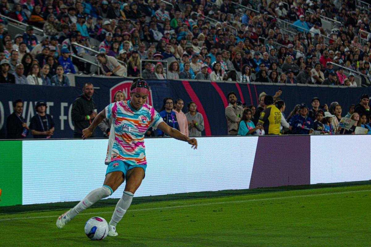 Defender Trinity Armstrong dribbles down the sideline during a match against the Washington Spirit at Snapdragon Stadium on June 22, 2025.
