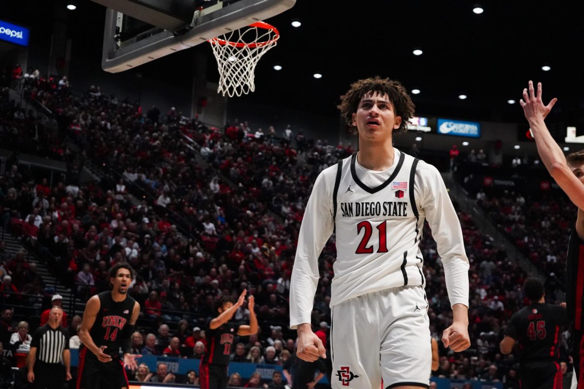 San Diego State guard Miles Byrd poses for the crowd at Viejas Arena during a game against UNLV last season.