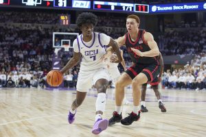 Former SDSU forward Elijah Saunders cuts off a GCU basketball player in the schools' most recent matchup on Dec. 5, 2023. Photo Courtesy of David Kadlubowski/GCU