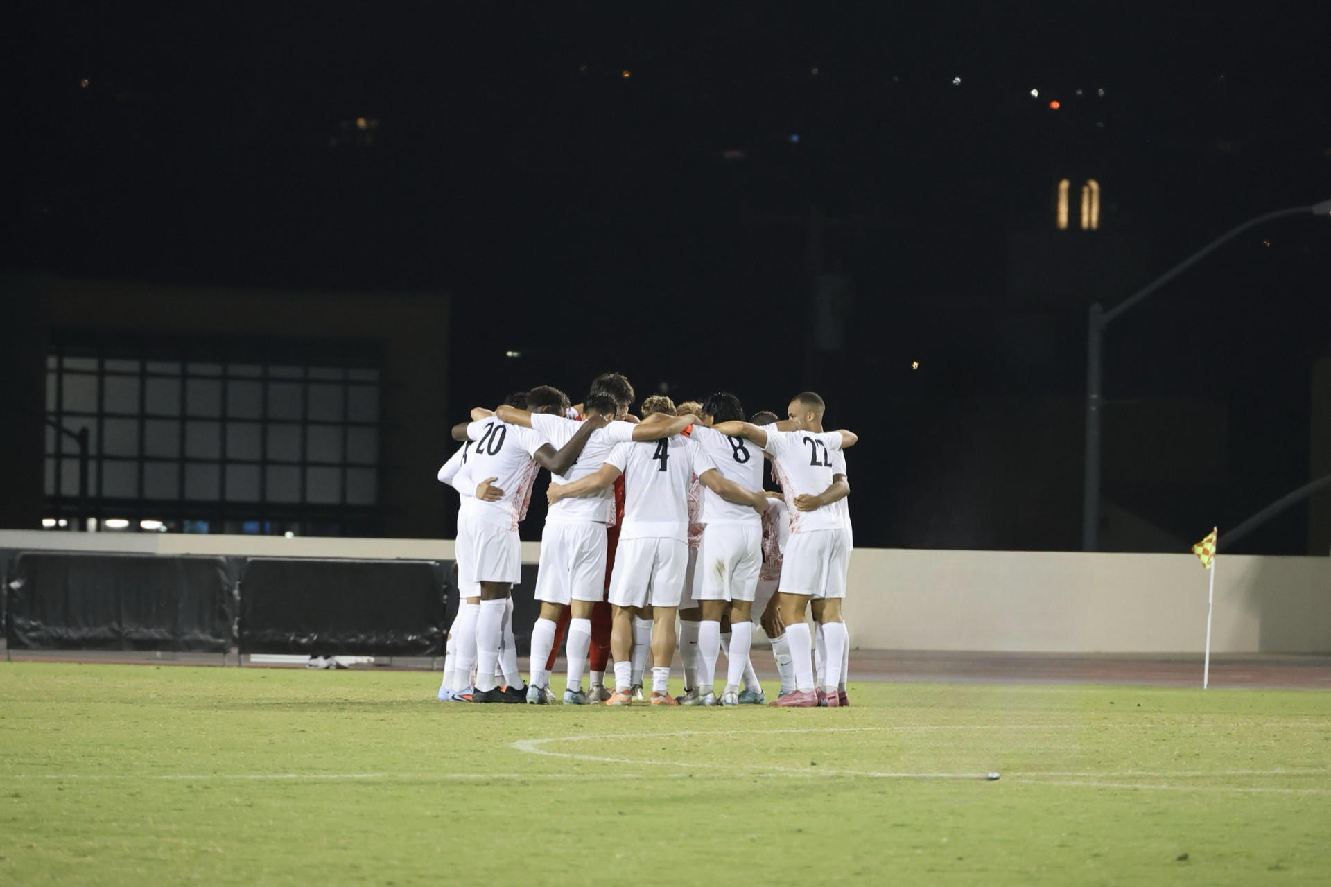 SDSU Men's Soccer Team gathers in a group huddle before the second half of the SDSU vs. UCSD match on Aug. 12 at the SDSU Sports Deck