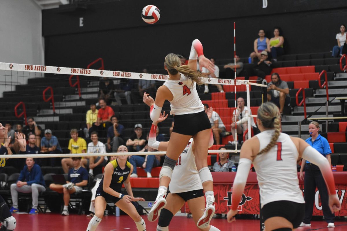 Junior middle blocker Amber Keen puts down a kill against UC San Diego on Sept. 18 at Peterson Gym.