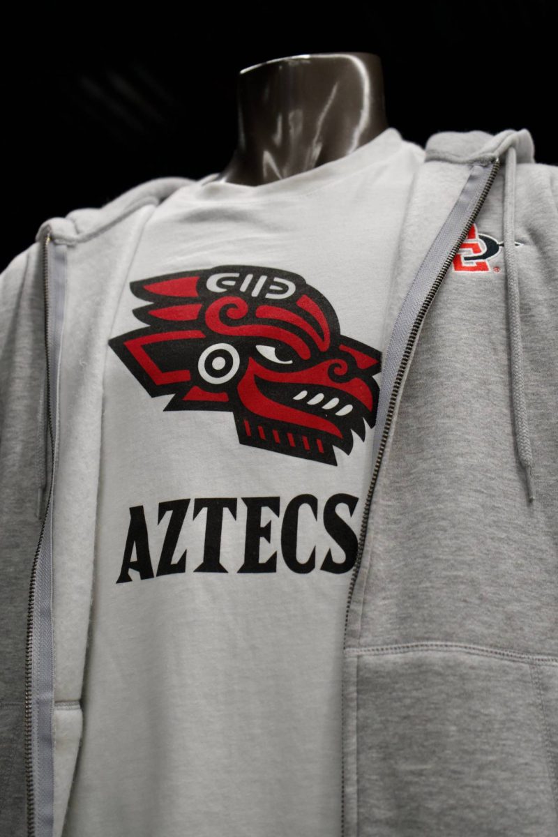 A shirt of the newly unveiled ehecatl mind logo of the three glyphs sit on a manikin at the San Diego State gift shop at Snapdragon Stadium on Friday, Oct. 3, 2025.  