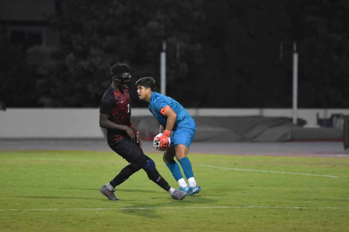 With the help of Senior Christian Engmann, Goalie Eddie Vargas stops the goal scoring opportunity at the Sports Deck on October 9th, 2025. 