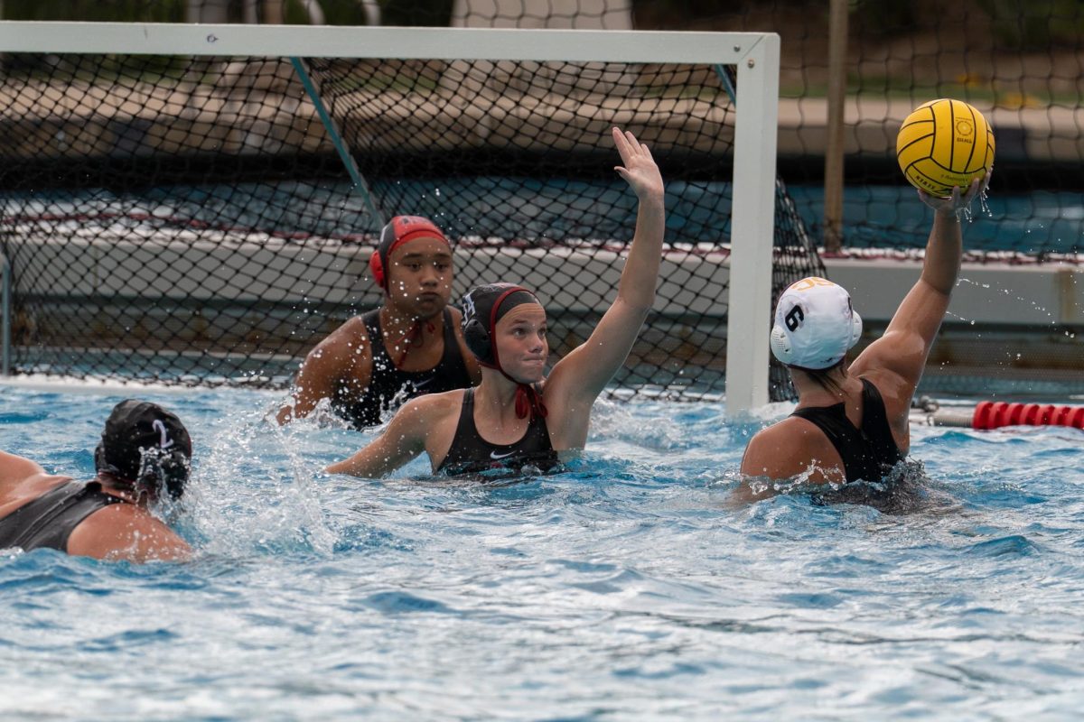 San Diego State junior attacker Sammi Byers attempts to block a shot in an 8-22 loss to the #2 USC Trojans on Saturday, Jan. 24, 2026, at the Aztec Aquaplex.