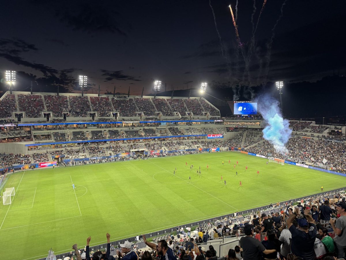A flare ignites from the Frontera SD section of Snapdragon Stadium following an SDFC goal in a friendly match against Club Tijuana on Sept. 16, 2025. Photo by Samuel Cozart.
