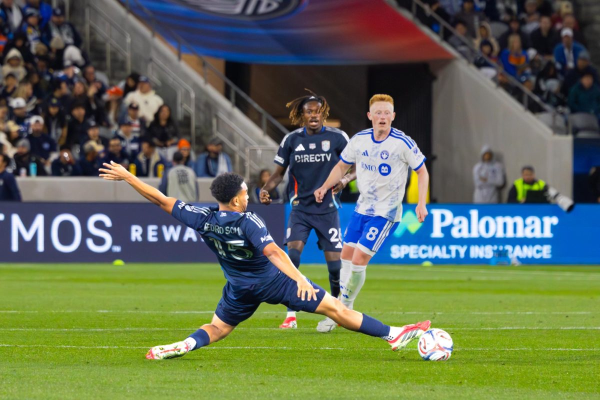 SDFC midfielder David Vazquez slides to deflect the ball off the Montreal defender at Snapdragon Stadium on Saturday, Feb. 21.
