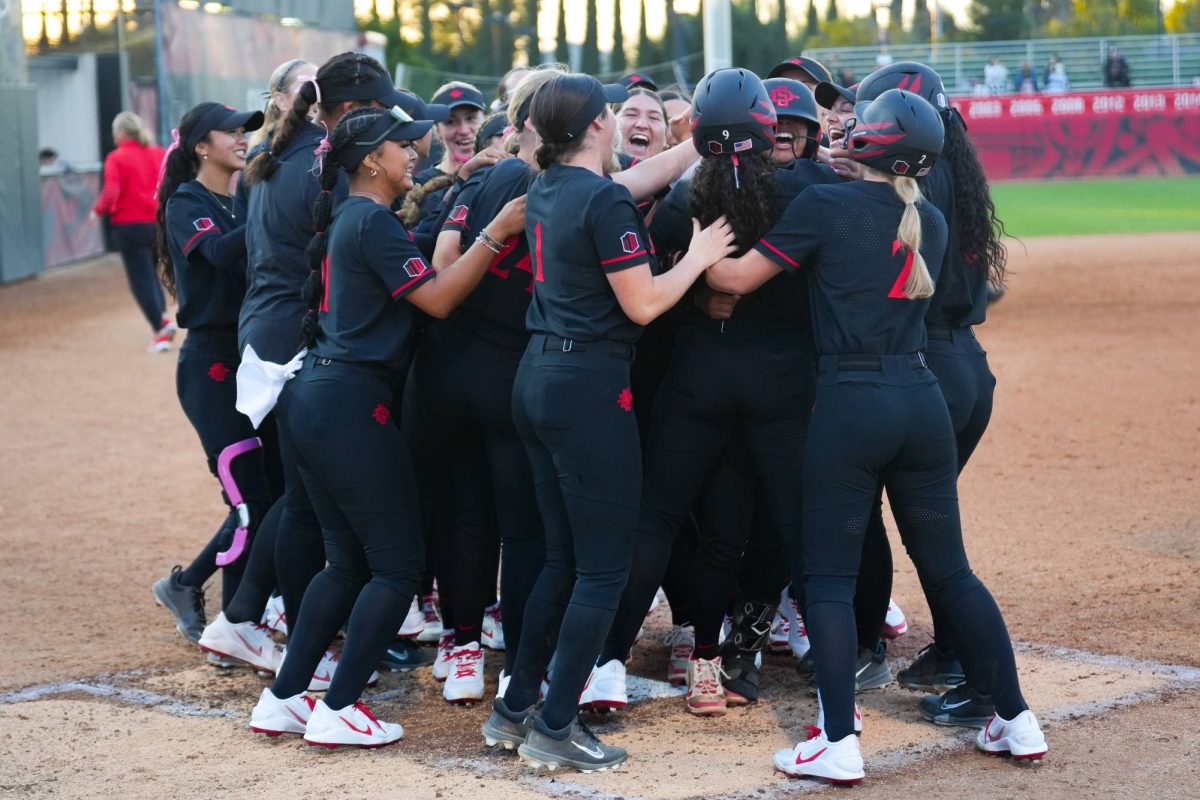 The SDSU softball team celebrates the team's first home run of the season against Minnesota on Feb. 6th, 2026.