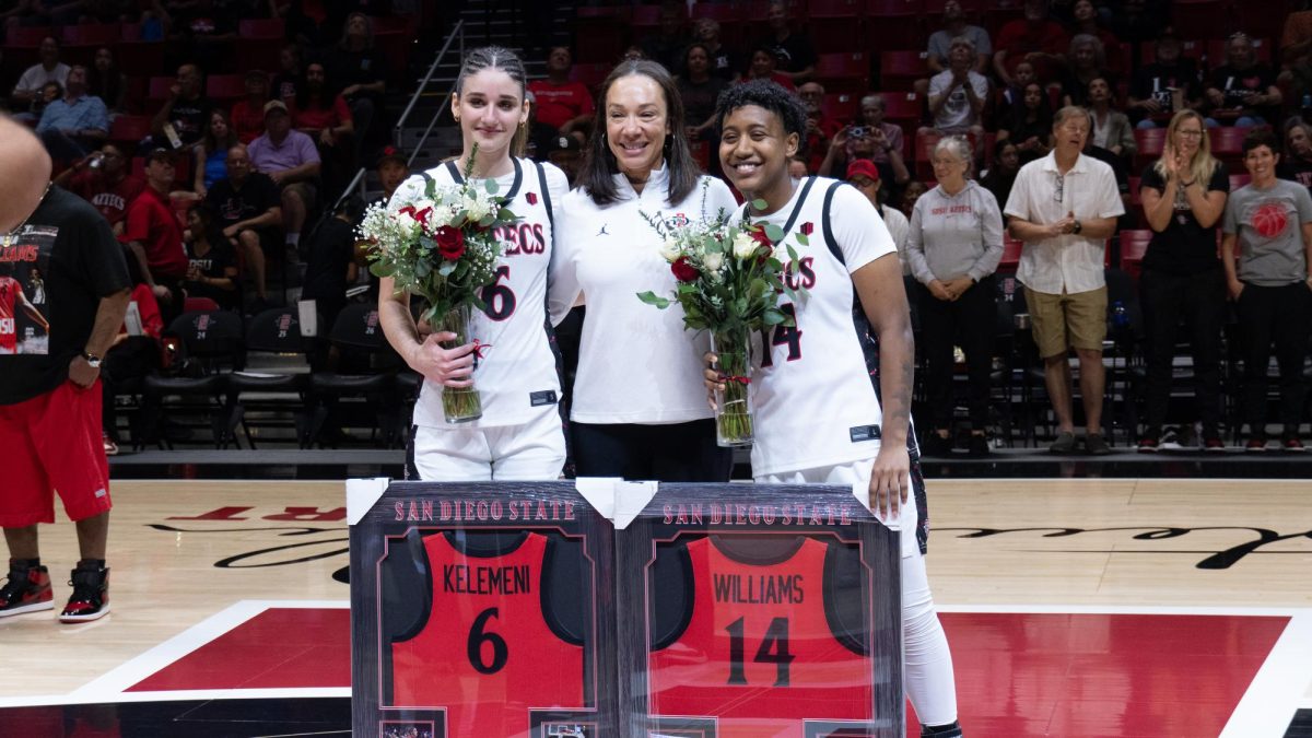 Senior guard Nala Williams and senior guard/forward Sofia Kelemeni stand with head coach Stacie Terry-Hudson for senior night on Feb. 28, 2026 at Viejas Arena.
