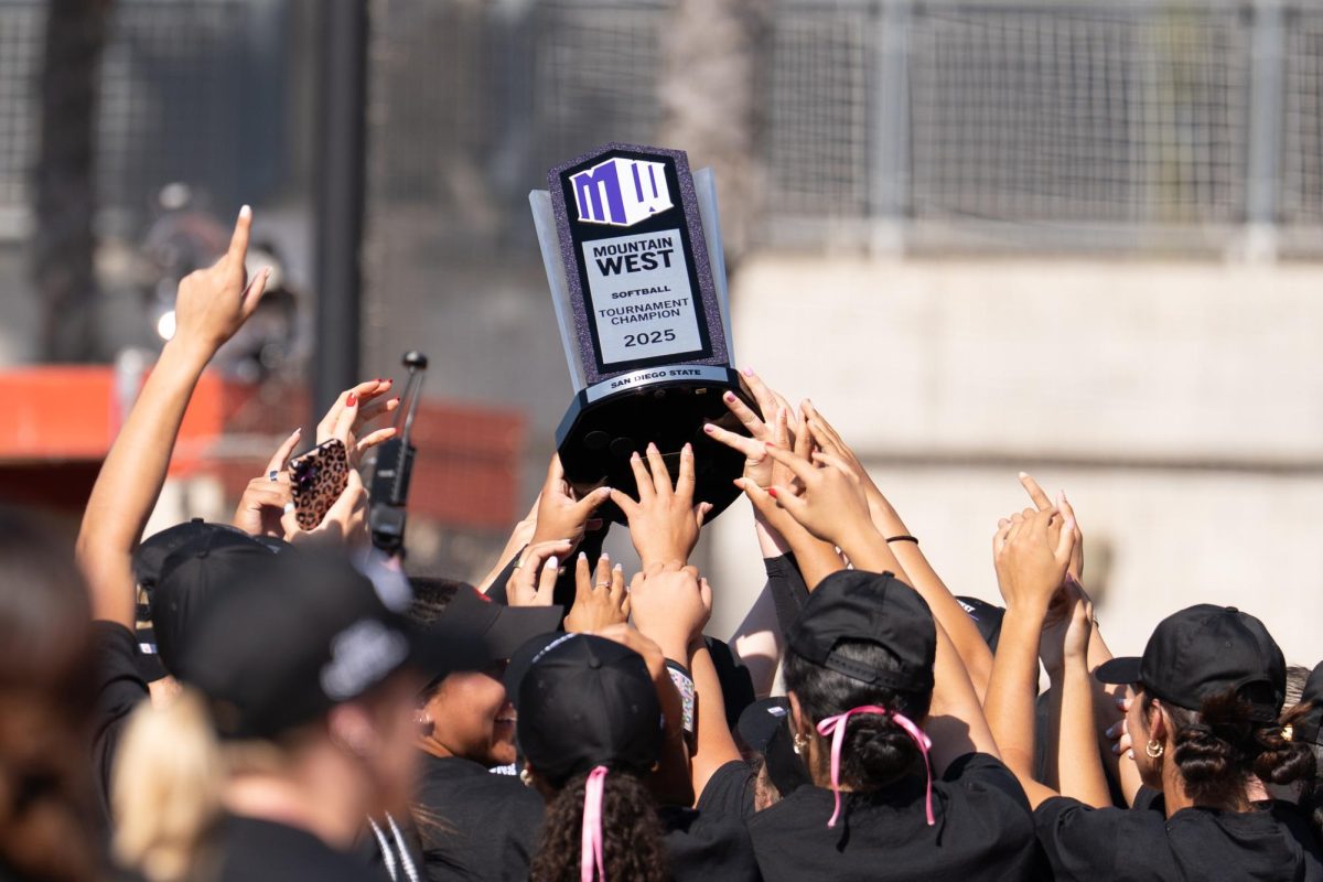 SDSU Softball lifts the Mountain West softball tournament trophy in a 3-1 win over No. 3 Fresno State on Saturday, May 10, 2025, at the SDSU Softball Arena. 