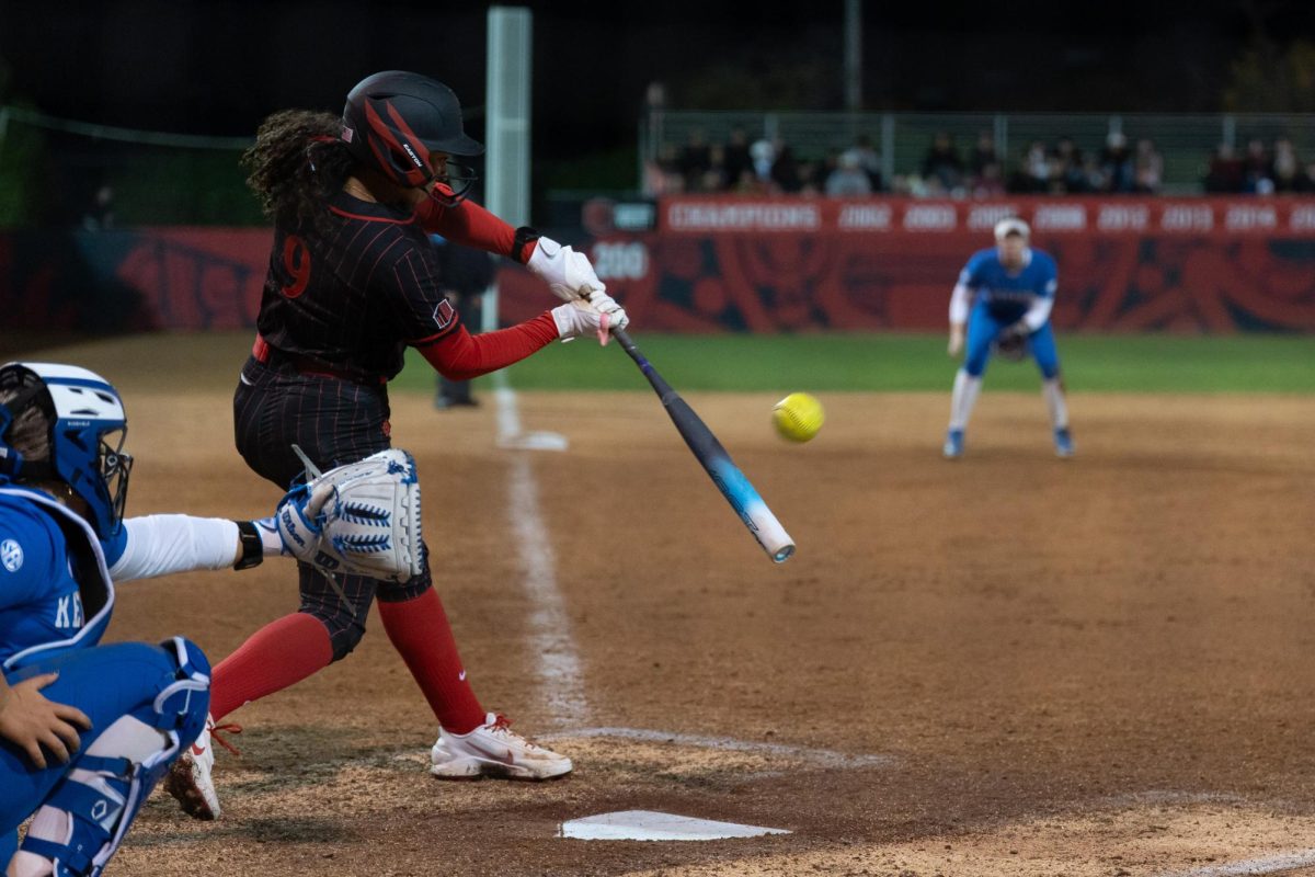 San Diego State junior utility Jazmin Williams swings for the ball in a 3-4 win against Kentucky Saturday, Feb. 7, 2026, at the SDSU Softball Stadium. 