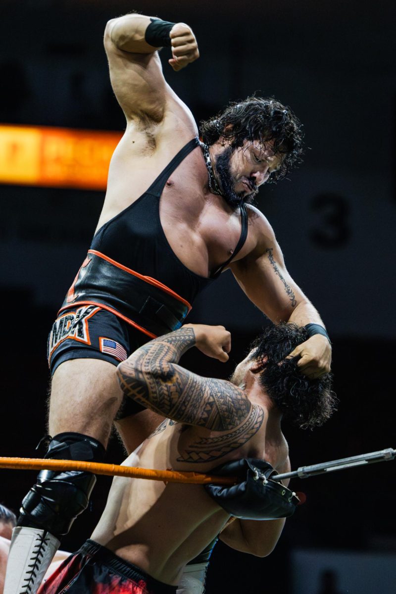 Wrestler Tito Escondido drops an elbow onto his opponent during the 20-man Royal Rumble at Pechanga Arena on Mar. 21, 2026
