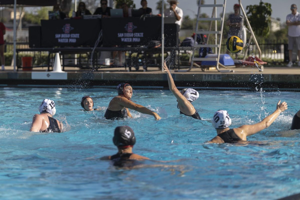 San Diego State senior utility Megan Holcomb makes a shot on goal during her Senior Day matchup against Brown on Friday, Mar. 27, 2026 at the Aztec Aquaplex.
