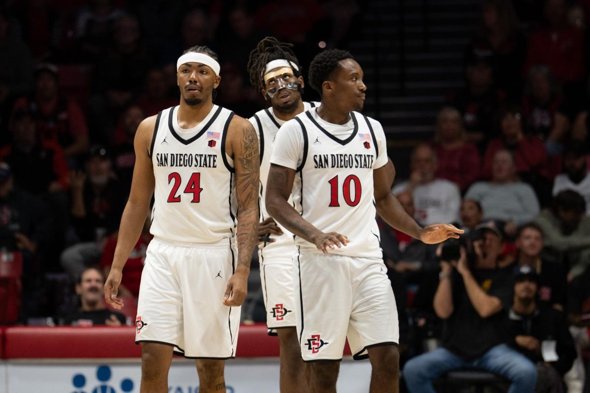 (Left to right) San Diego State's Taj Degourville, Pharoah Compton, and BJ Davis at Viejas Arena during a game against Utah State, Wednesday, Feb.25, 2026. 