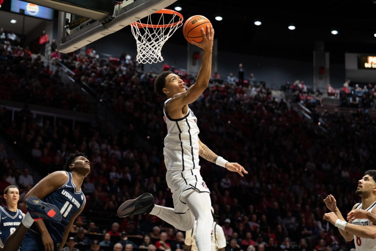 San Diego State freshman guard Elzie Harrington attempts a layup in a 89-72 win against Utah State Wednesday, Feb.26, 2026, at Viejas Arena.