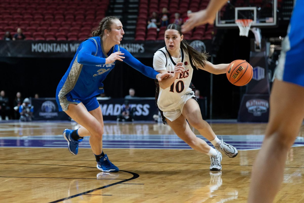 San Diego State sophomore guard Nat Martinez dribbles past Air Force senior forward Emily Adams in a 76-83 loss, Sunday, Mar. 8, 2026, at the Thomas & Mack Center, Las Vegas, NV.