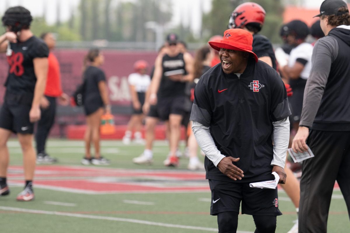San Diego State wide receiver coach Matthew Middleton yells during spring practice at San Diego State University, Tuesday, Mar. 24, 2026.