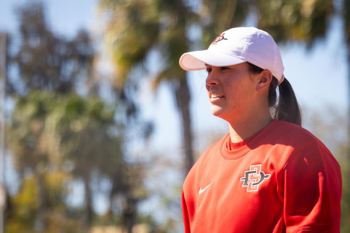 San Diego State Madilyn Nickles-Camarena watches her players get loose in between innings during the game against Princeton on Mar. 8, 2025