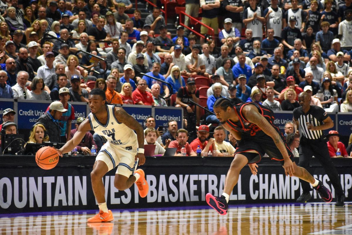 Senior Guard Reese Dixon-Waters chases after his opponent during SDSU's game against Utah State on Sat. March 14, 2026