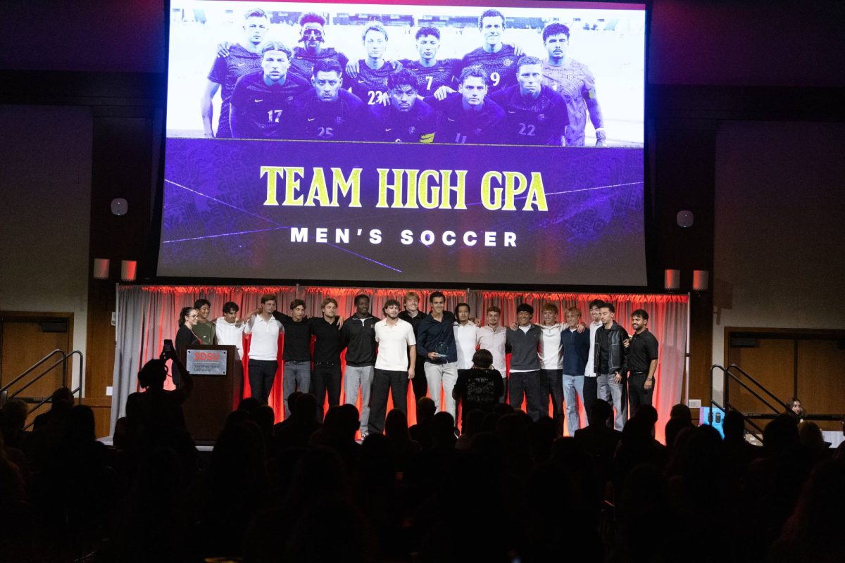 The San Diego State men's soccer team poses for a picture on stage after a team high GPA at Montezuma hall on Monday, April 20, 2026.