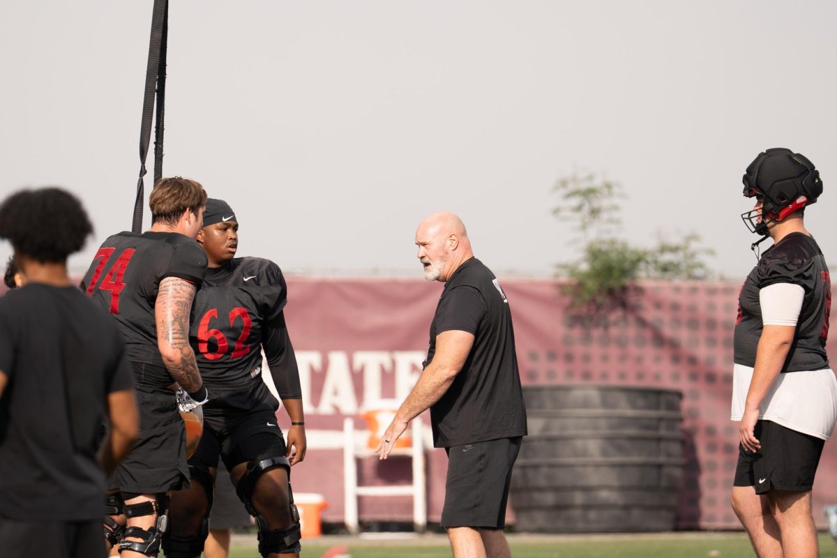 San Diego State offensive line coach Bill O'Boyle communicates with his team during a spring practice, Thursday, April 9, 2026, at San Diego State University.