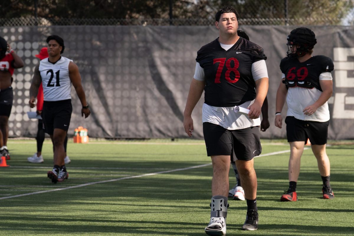 San Diego State senior offensive lineman Joseph Borjon walks with a boot during a spring practice at San Diego State University, Tuesday, April. 14, 2026, San Diego, CA.